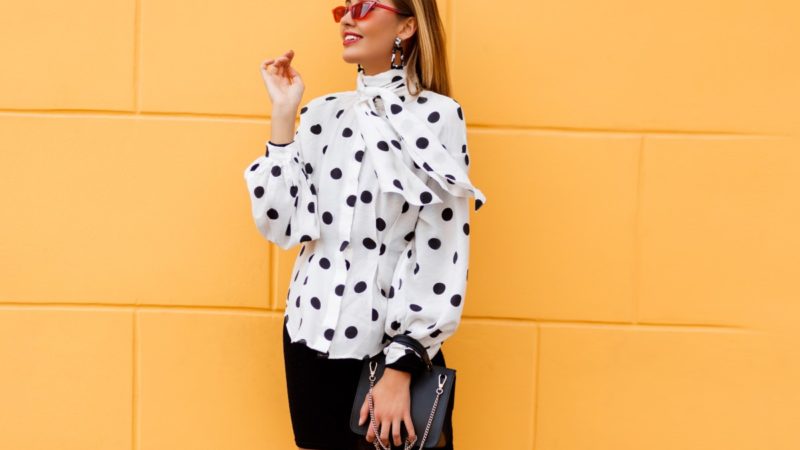 graceful woman stylish casual outfit posing with black leather luxury bag 1